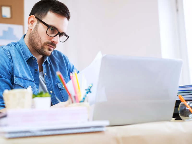 A man looking at a laptop screen.